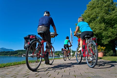 Cyclists at promenade in Prien at Lake Chiemsee