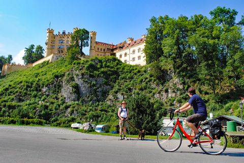 Cyclist in front of Castle Hohenschwangau
